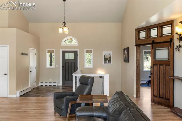 a view of a entryway with furniture and wooden floor