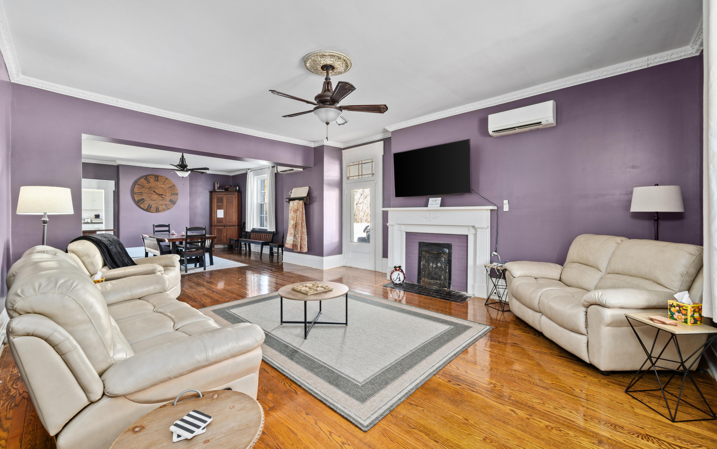 19391 Main Street Buchanan, VA 24066 - Photo 11 of 34 a living room with furniture a fireplace and a flat screen tv