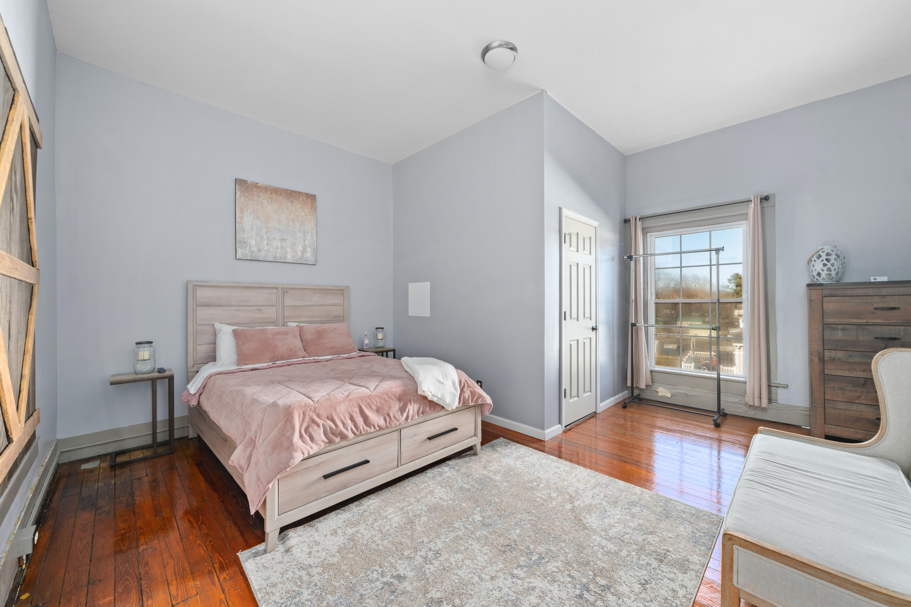 19391 Main Street Buchanan, VA 24066 - Photo 28 of 34 a bedroom with a bed and a couch