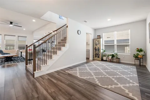 a view of a livingroom with furniture and an entryway