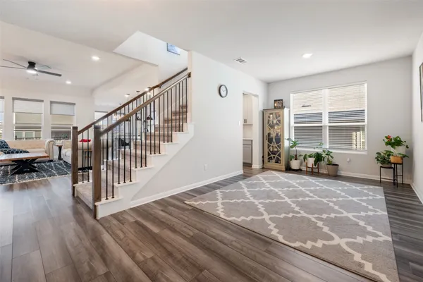 a view of a livingroom with furniture and an entryway