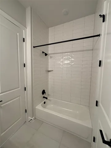 a bathroom with a shower and a bath tub