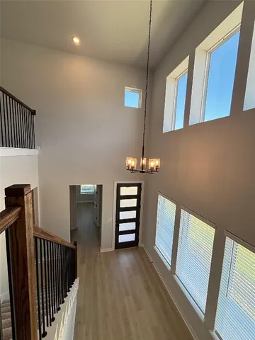 a view of a livingroom with furniture and staircase