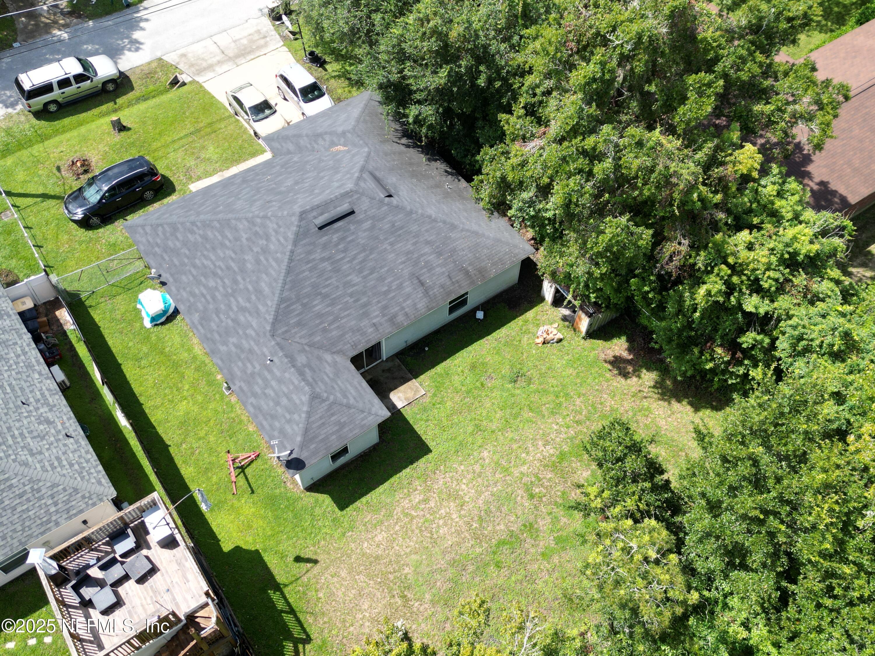 7071 Luke Street Jacksonville, FL 32210 - Photo 2 of 2 an aerial view of a house with a yard