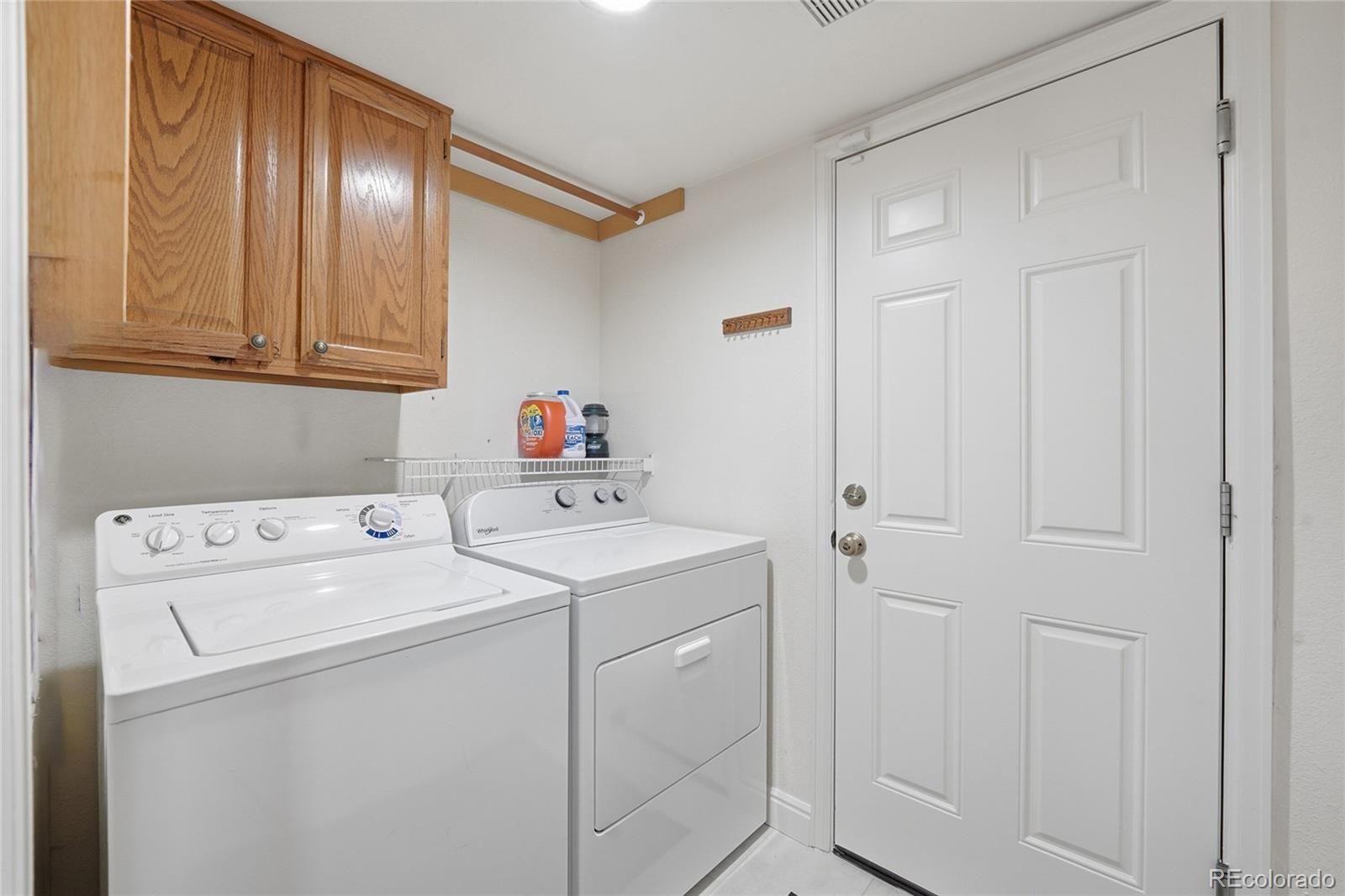 9264 Madras Court Highlands Ranch, CO 80130 - Photo 18 of 50 a utility room with dryer and washer