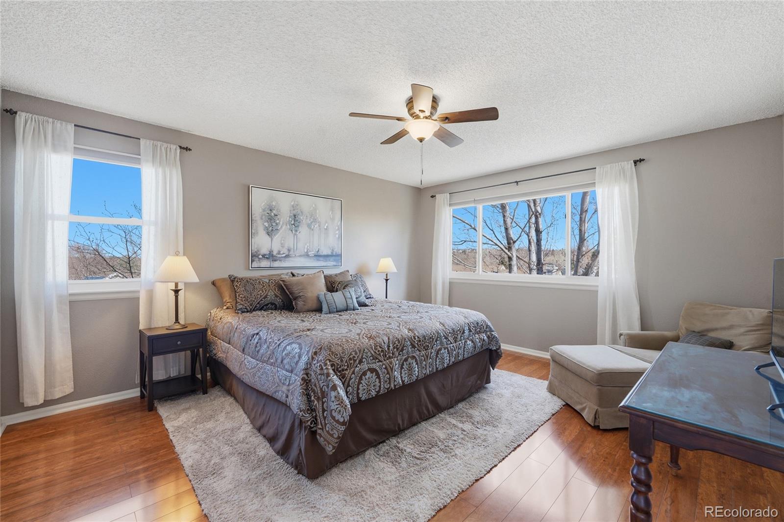 9264 Madras Court Highlands Ranch, CO 80130 - Photo 24 of 50 a bedroom with a bed and window