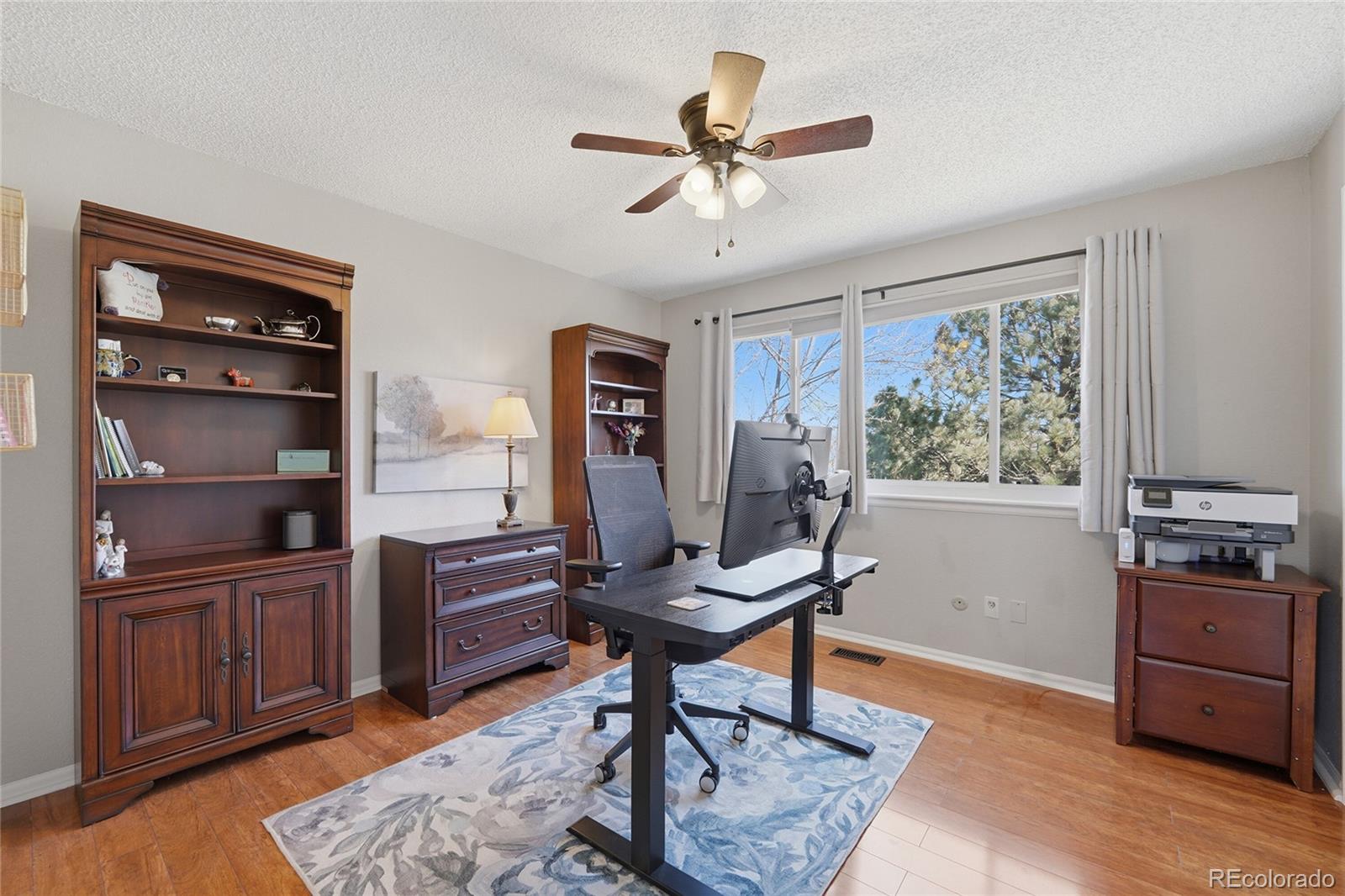 9264 Madras Court Highlands Ranch, CO 80130 - Photo 26 of 50 a work room with furniture and wooden floor
