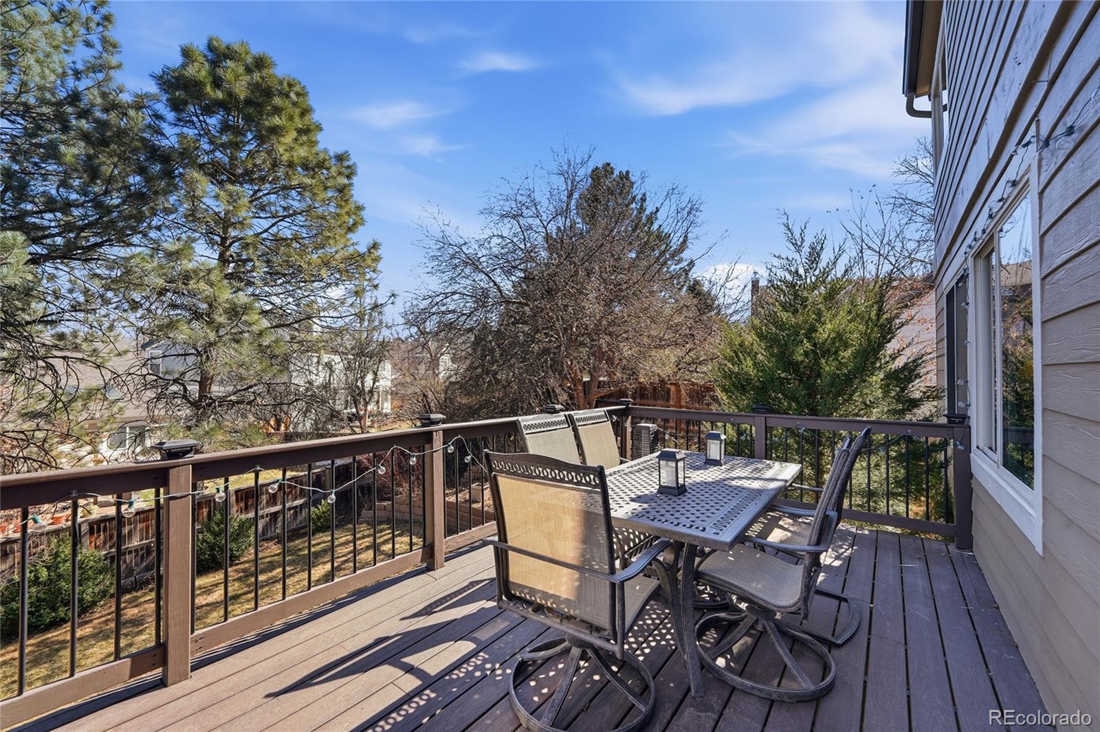 9264 Madras Court Highlands Ranch, CO 80130 - Photo 32 of 50 a view of balcony with furniture and wooden deck