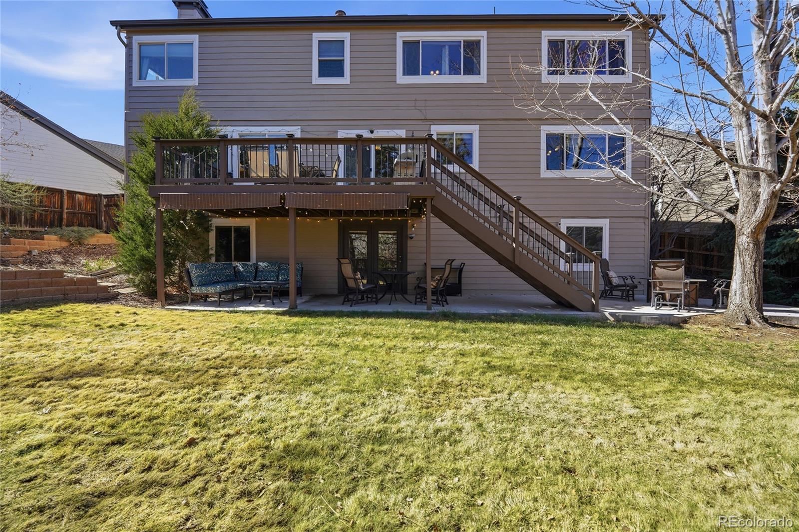 9264 Madras Court Highlands Ranch, CO 80130 - Photo 37 of 50 a view of a house with a yard