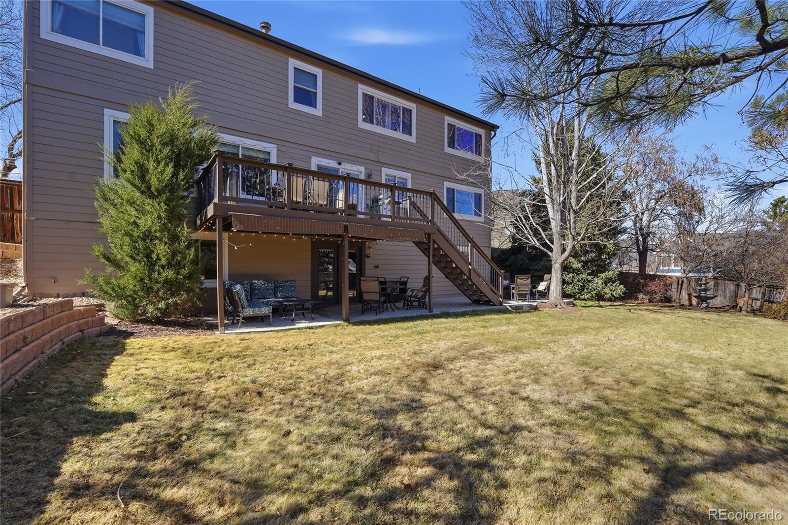 9264 Madras Court Highlands Ranch, CO 80130 - Photo 38 of 50 a view of a house with a yard