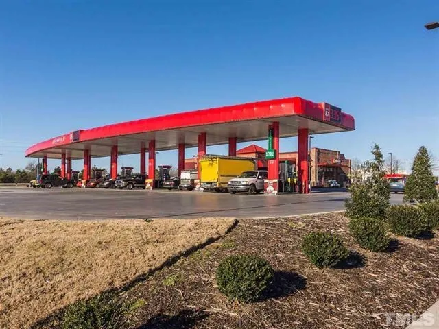 a view of street with small plants