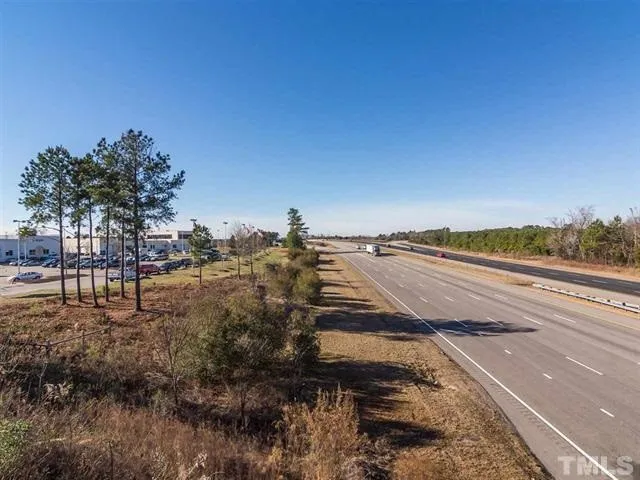 a view of a street with an ocean view
