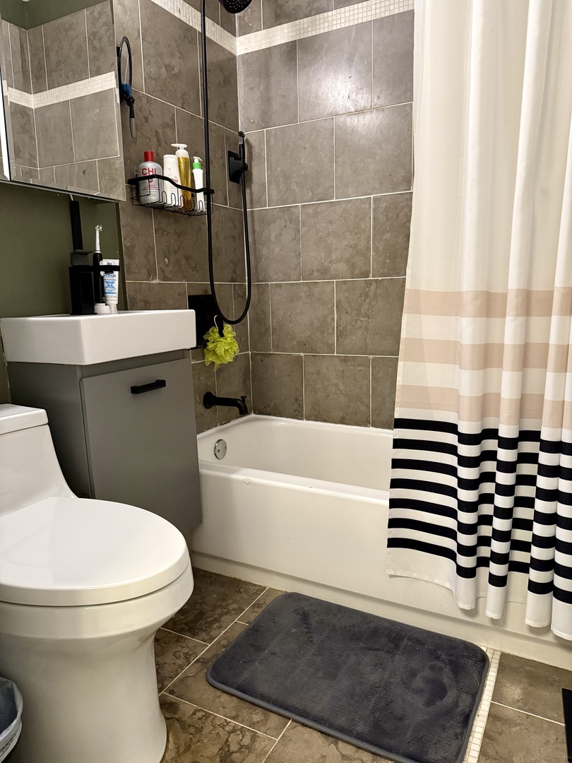 4720 North Beacon Street, Unit 2N Chicago, IL 60640 - Photo 26 of 26 a bathroom with a sink toilet and shower