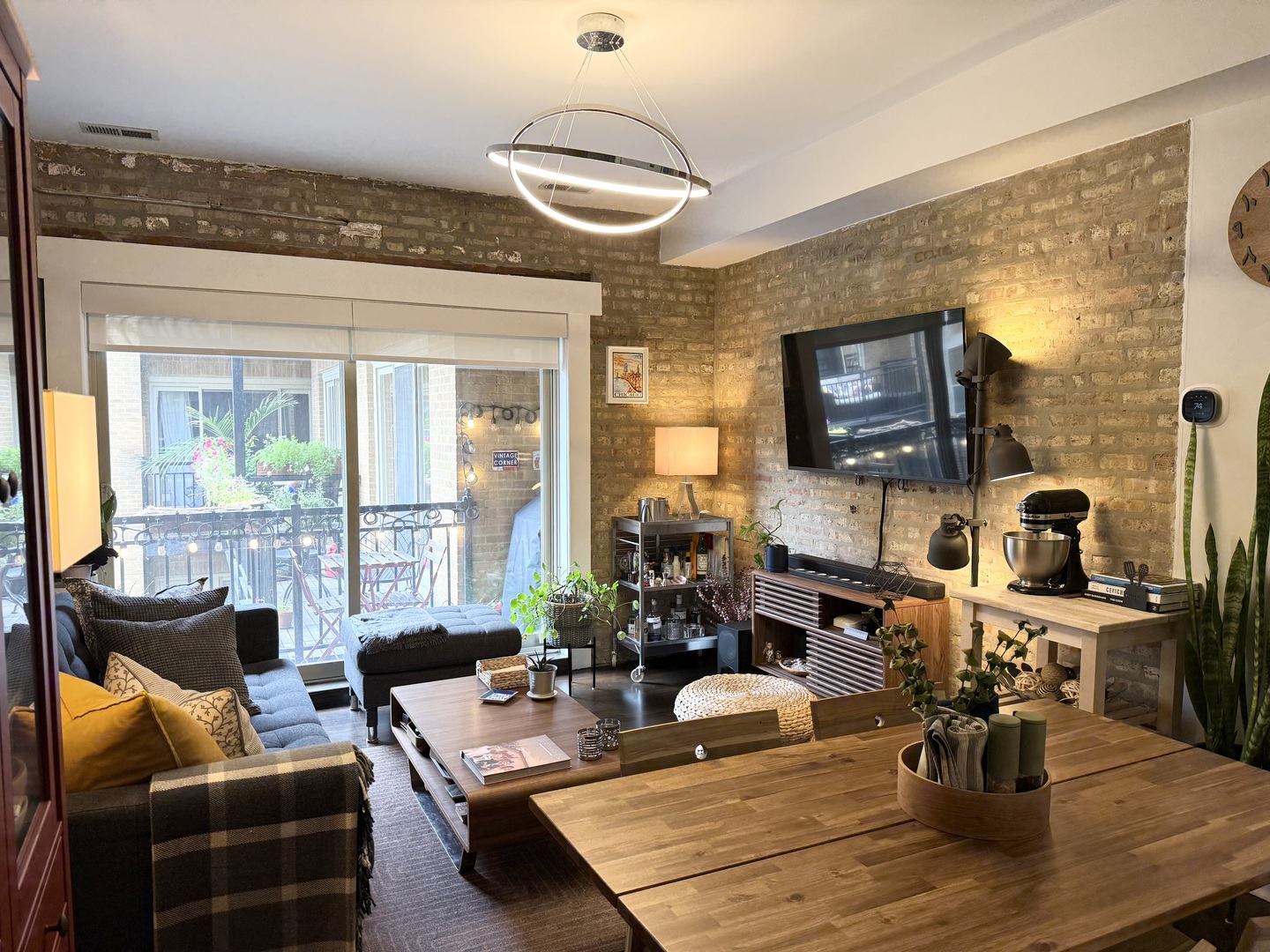 4720 North Beacon Street, Unit 2N Chicago, IL 60640 - Photo 7 of 26 a view of a livingroom with furniture and a flat screen tv