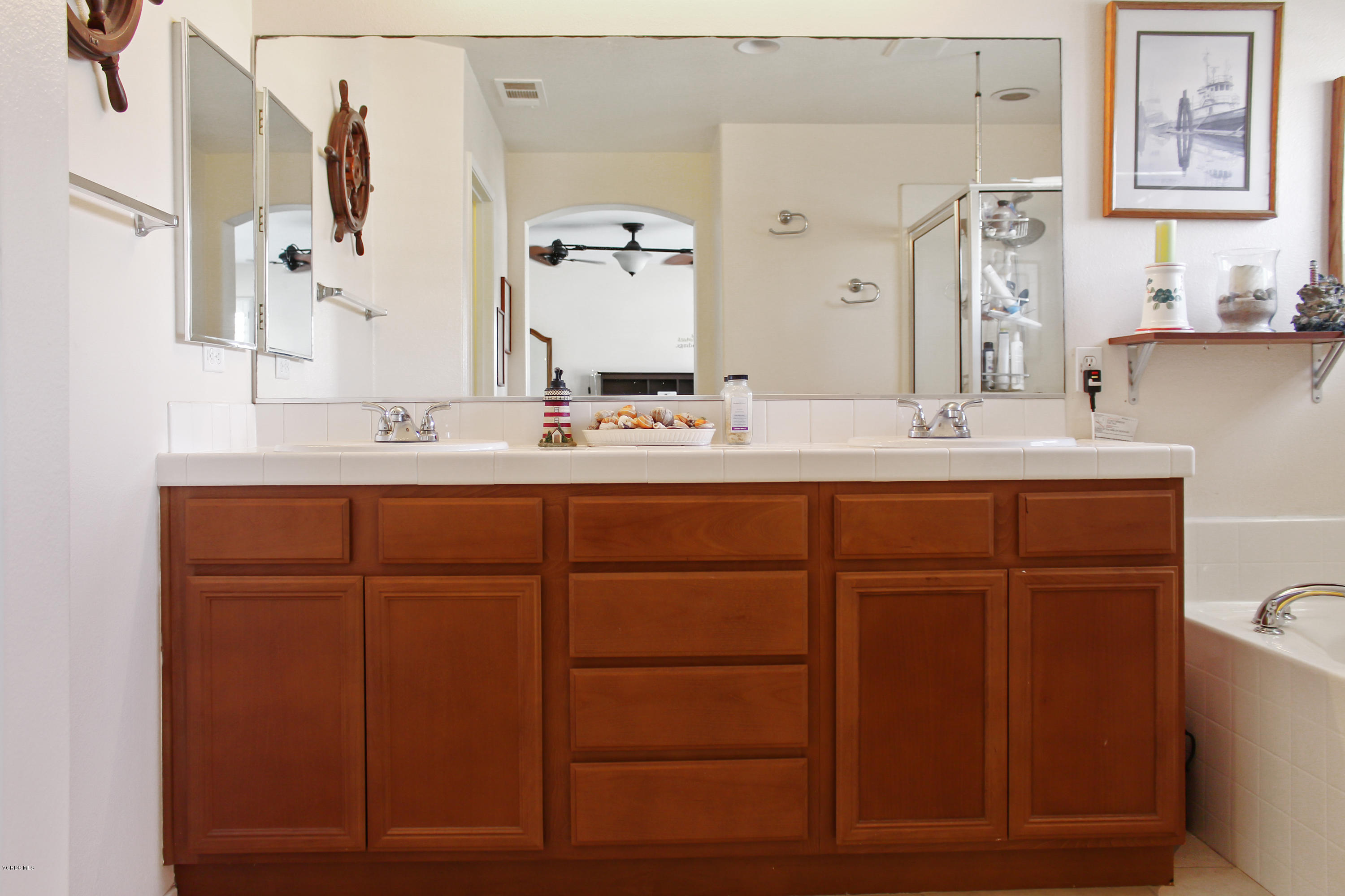 407 Field Street Oxnard, CA 93033 - Photo 12 of 15 a bathroom with a double vanity sink mirror and toilet