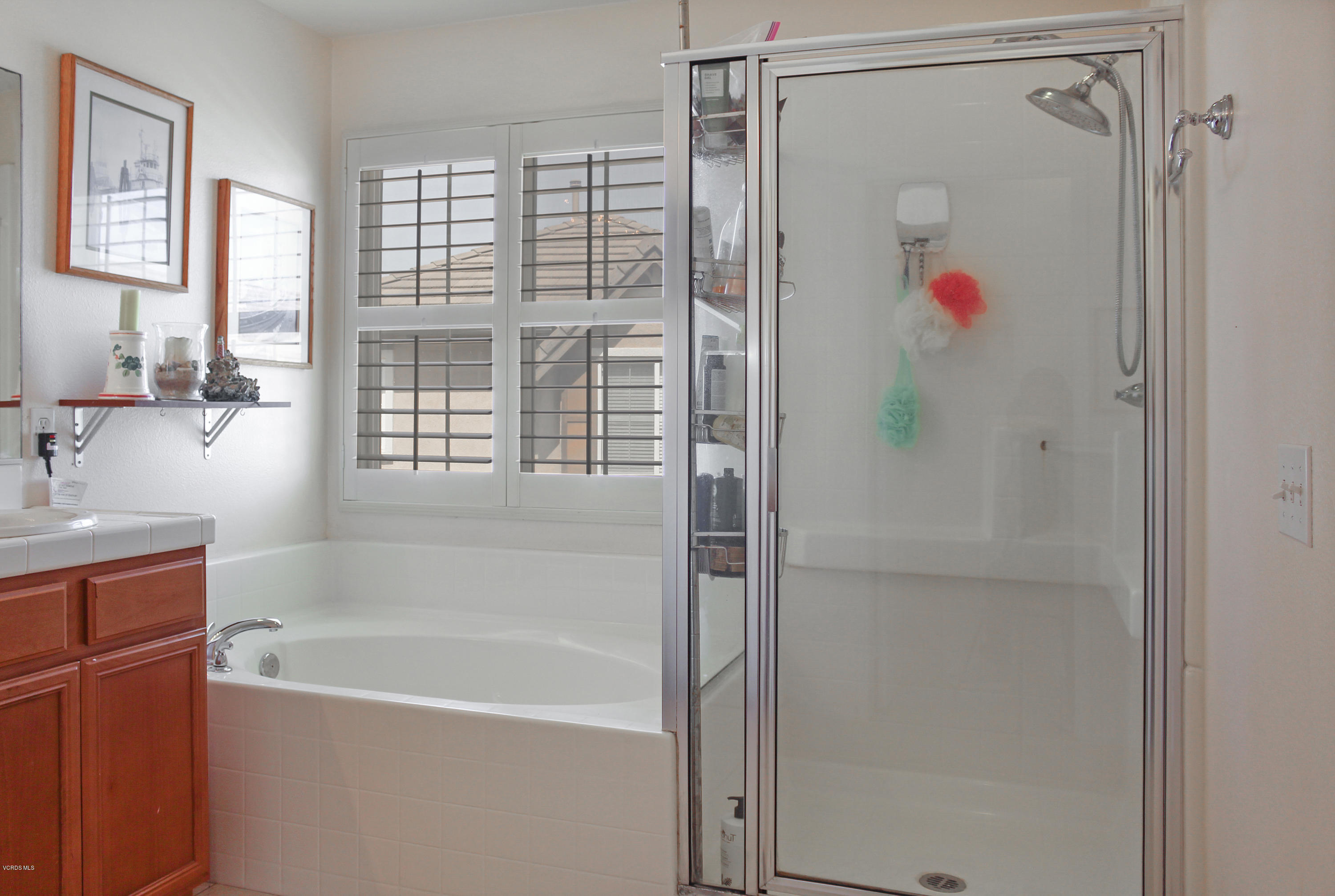 407 Field Street Oxnard, CA 93033 - Photo 13 of 15 a bathroom with a bathtub and a shower