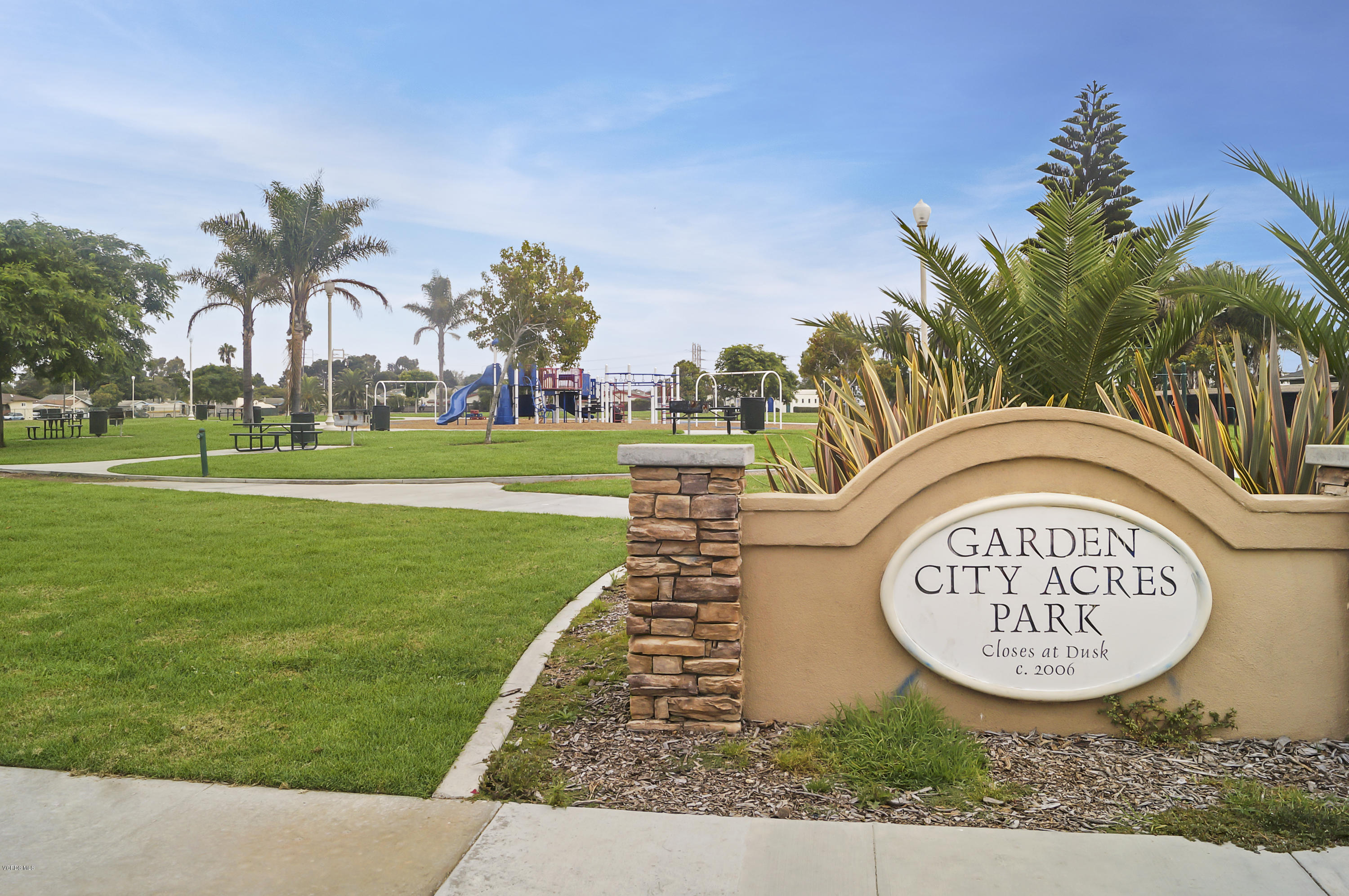 407 Field Street Oxnard, CA 93033 - Photo 14 of 15 a sign that is sitting on the side of the road