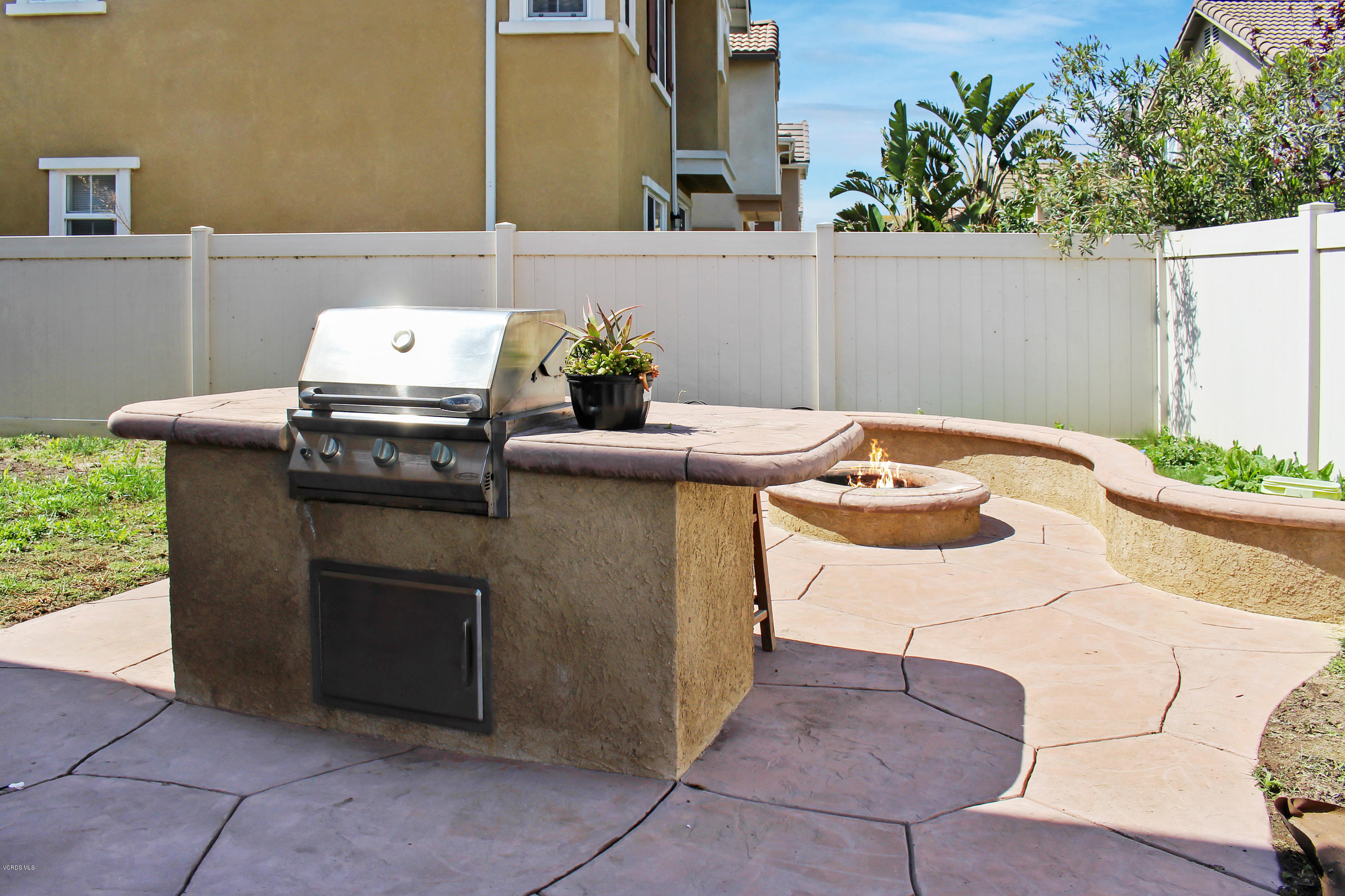 407 Field Street Oxnard, CA 93033 - Photo 6 of 15 a backyard of a house with table and chairs