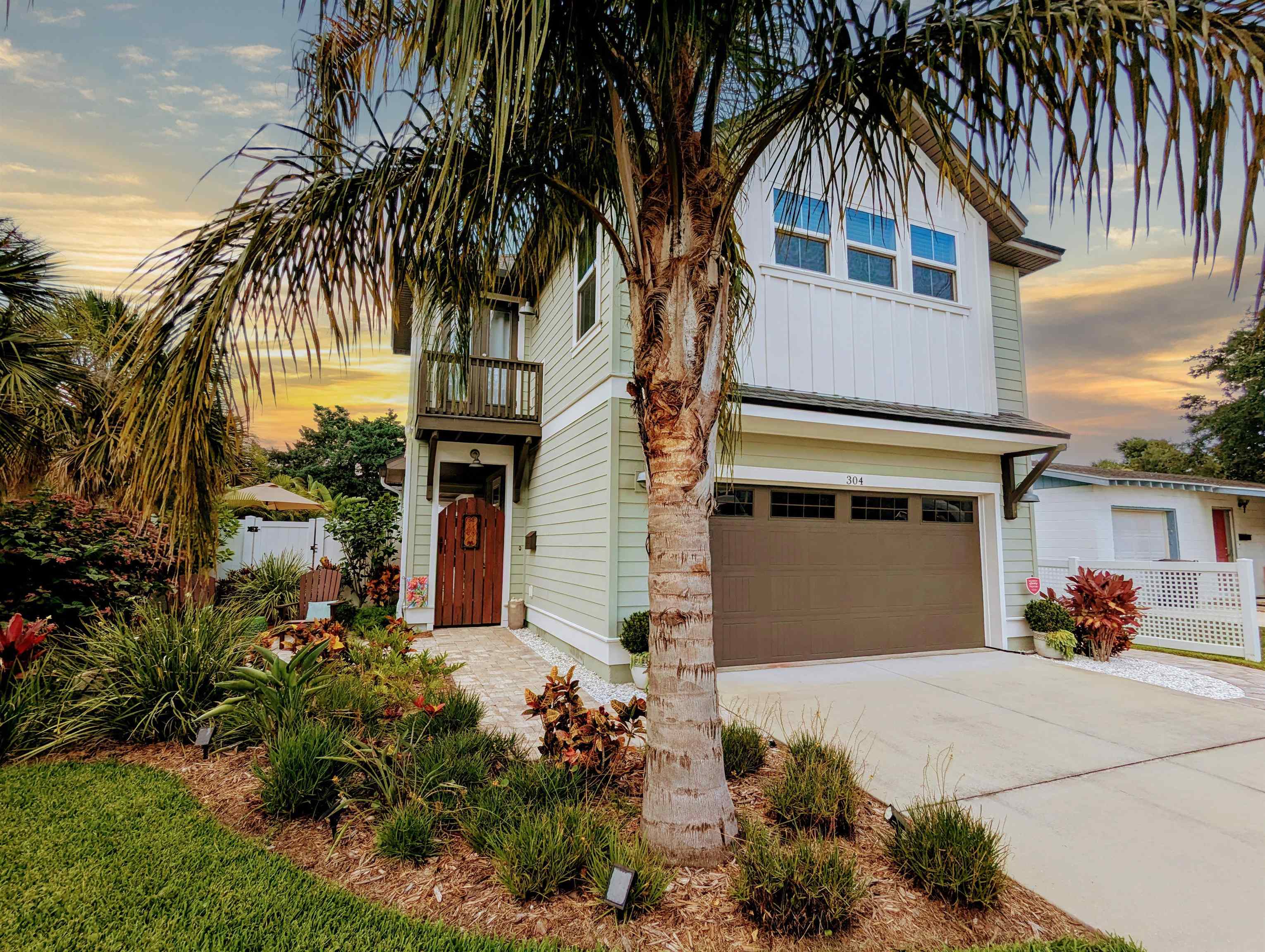 304 Ribault Street St. Augustine, FL 32080 - Photo 1 of 69 a front view of a house with a yard and garage