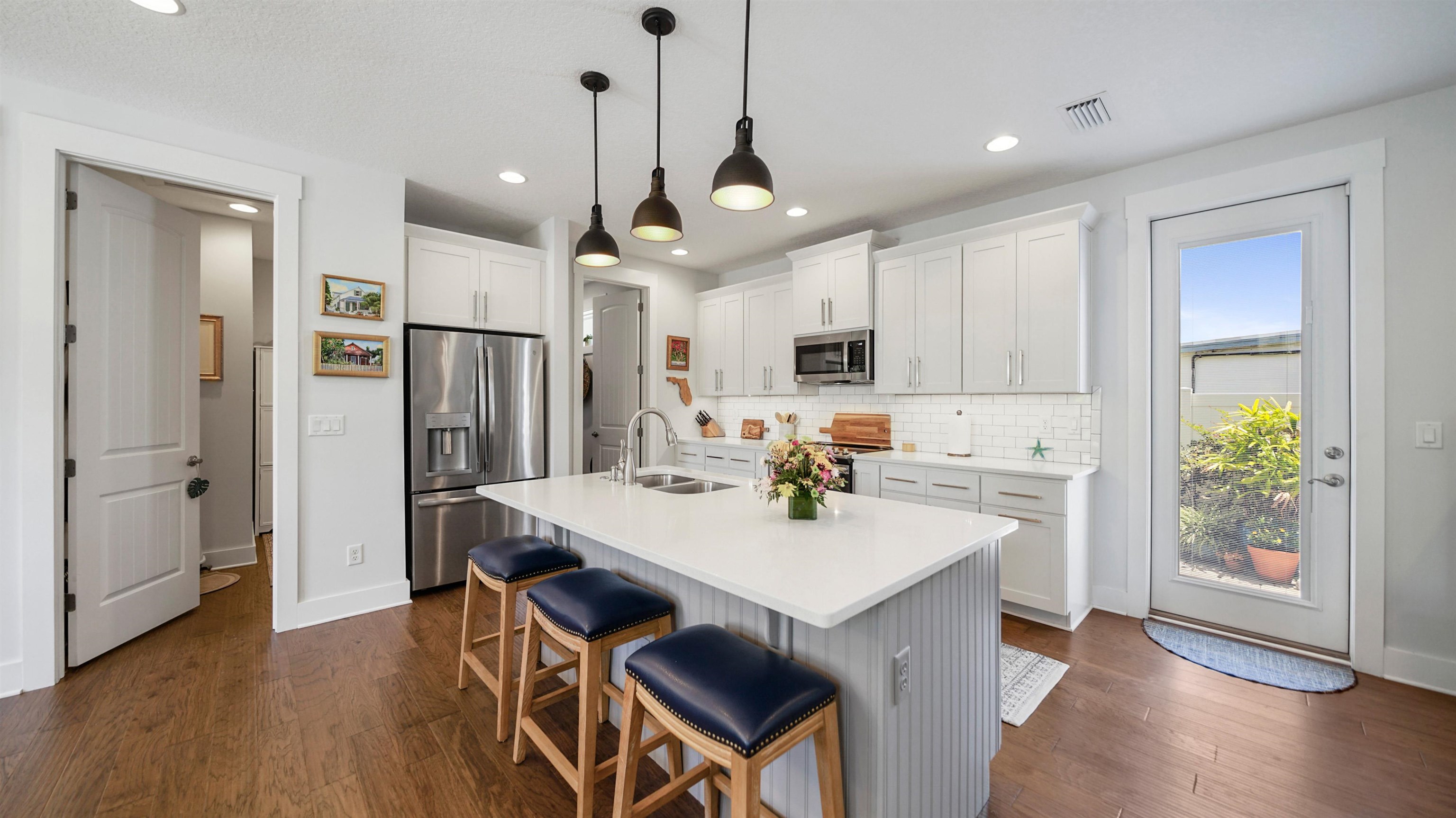 304 Ribault Street St. Augustine, FL 32080 - Photo 17 of 69 a kitchen with stainless steel appliances granite countertop a dining table chairs stove refrigerator and cabinets