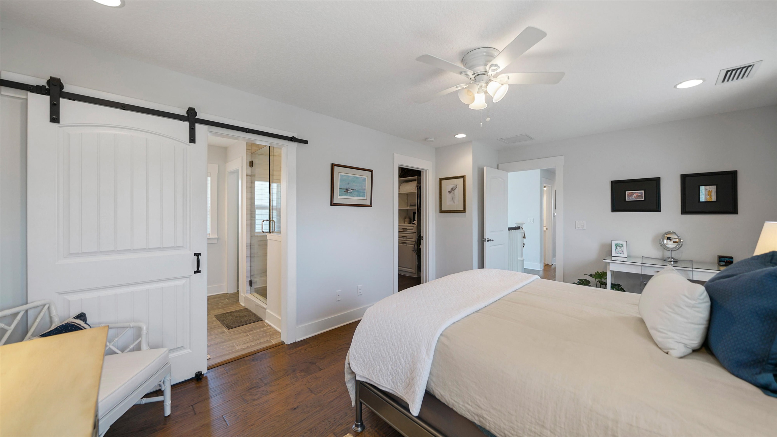 304 Ribault Street St. Augustine, FL 32080 - Photo 30 of 69 a spacious bedroom with a bed and a chandelier