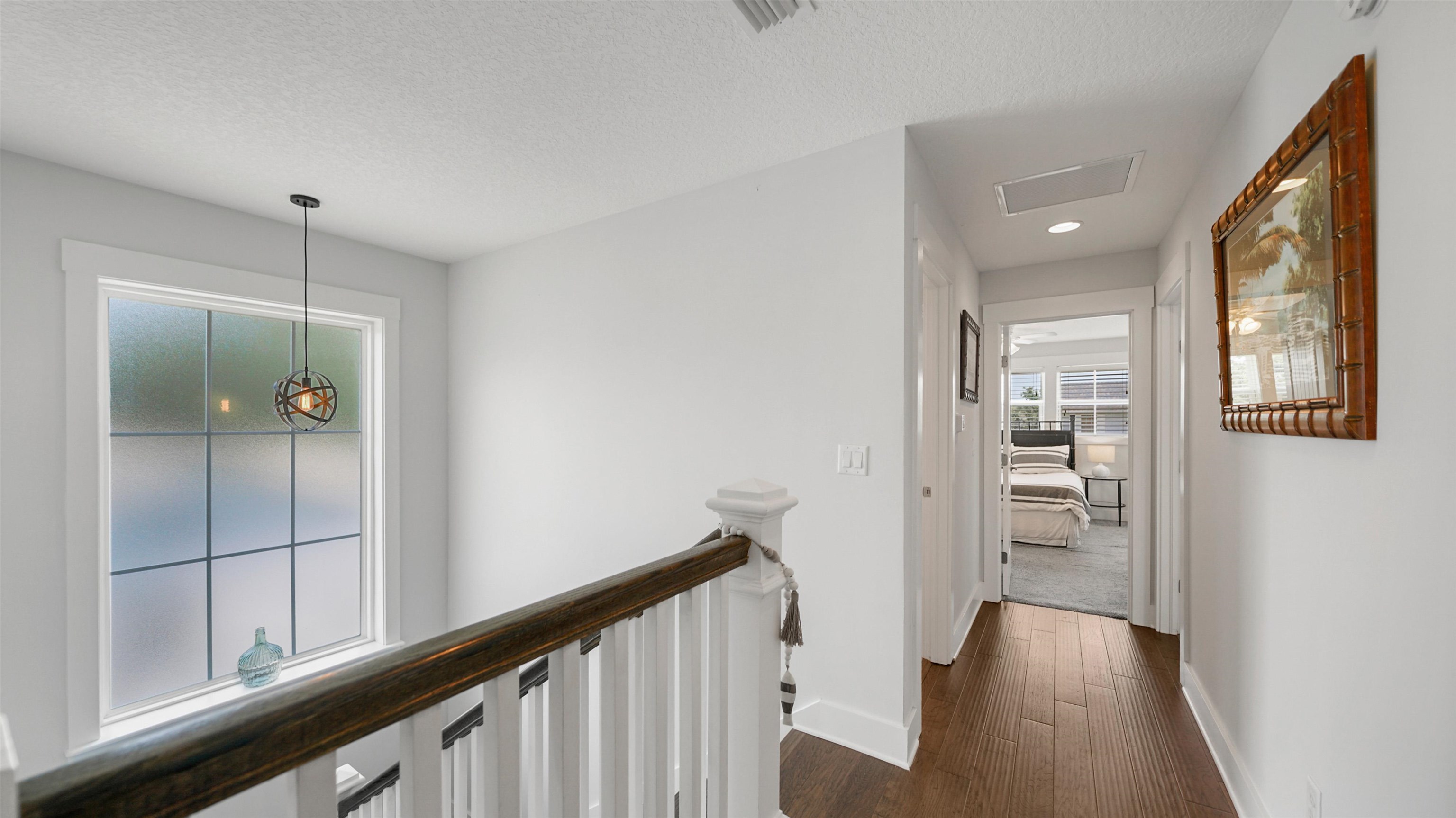 304 Ribault Street St. Augustine, FL 32080 - Photo 34 of 69 a view of a hallway with wooden floor and staircase