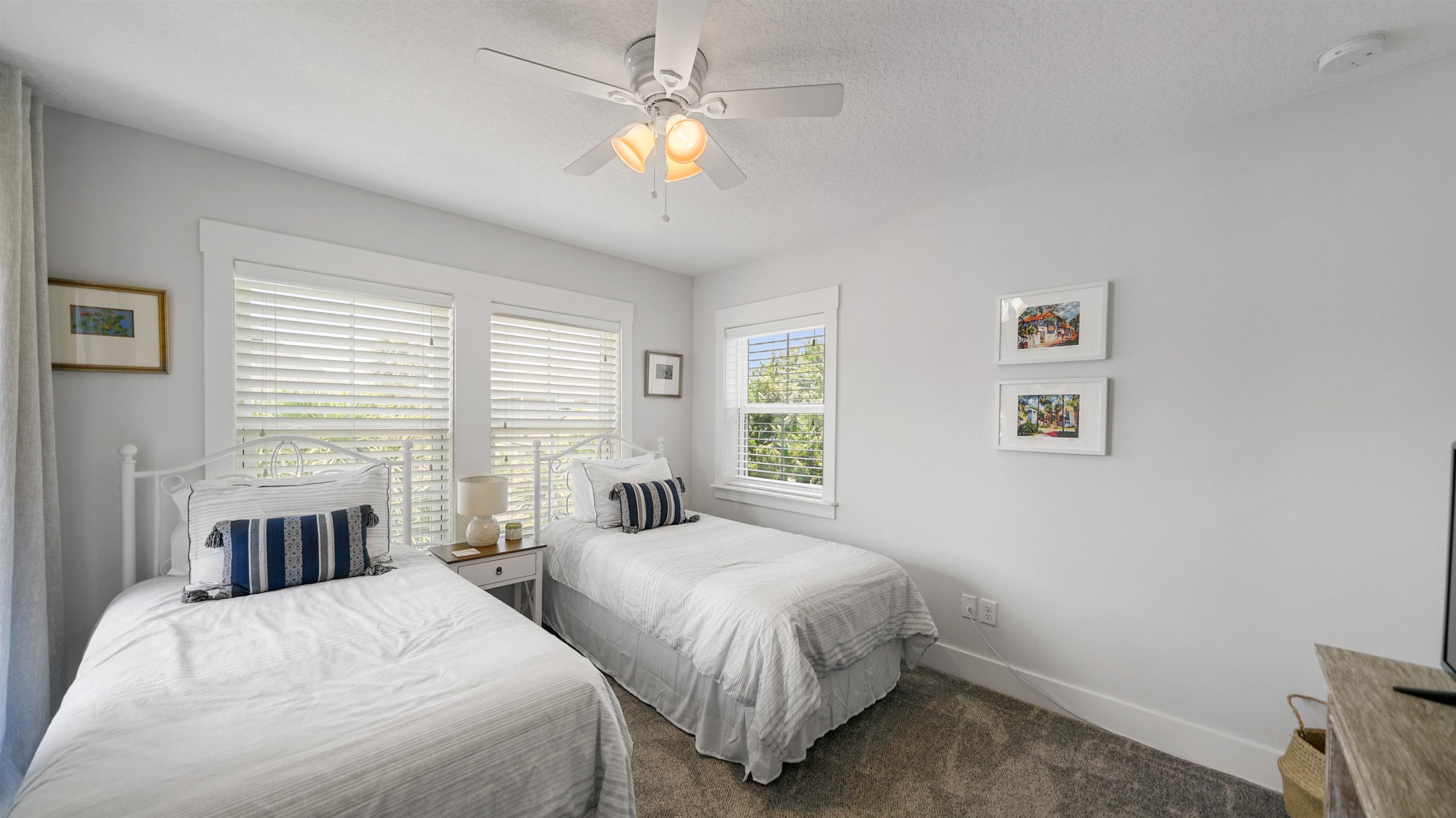 304 Ribault Street St. Augustine, FL 32080 - Photo 35 of 69 a spacious bedroom with two beds and a chandelier