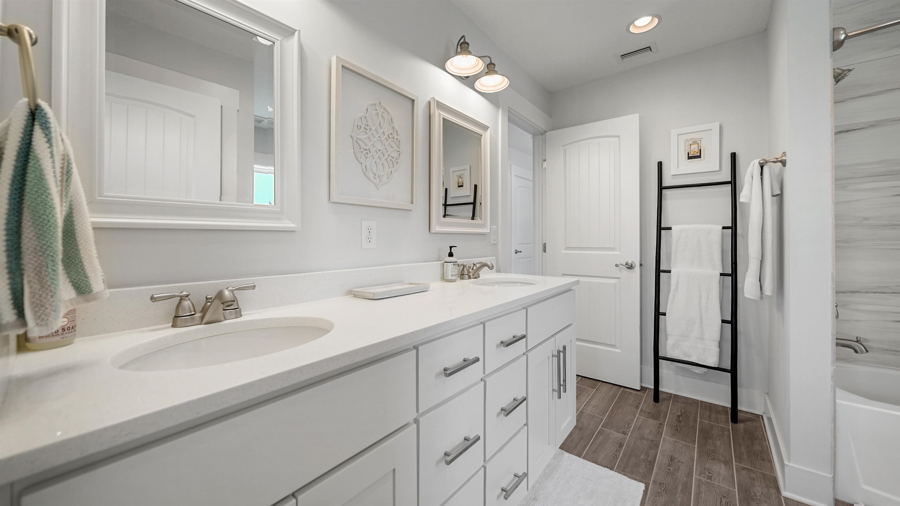 304 Ribault Street St. Augustine, FL 32080 - Photo 40 of 69 a bathroom with a double vanity sink mirror and double