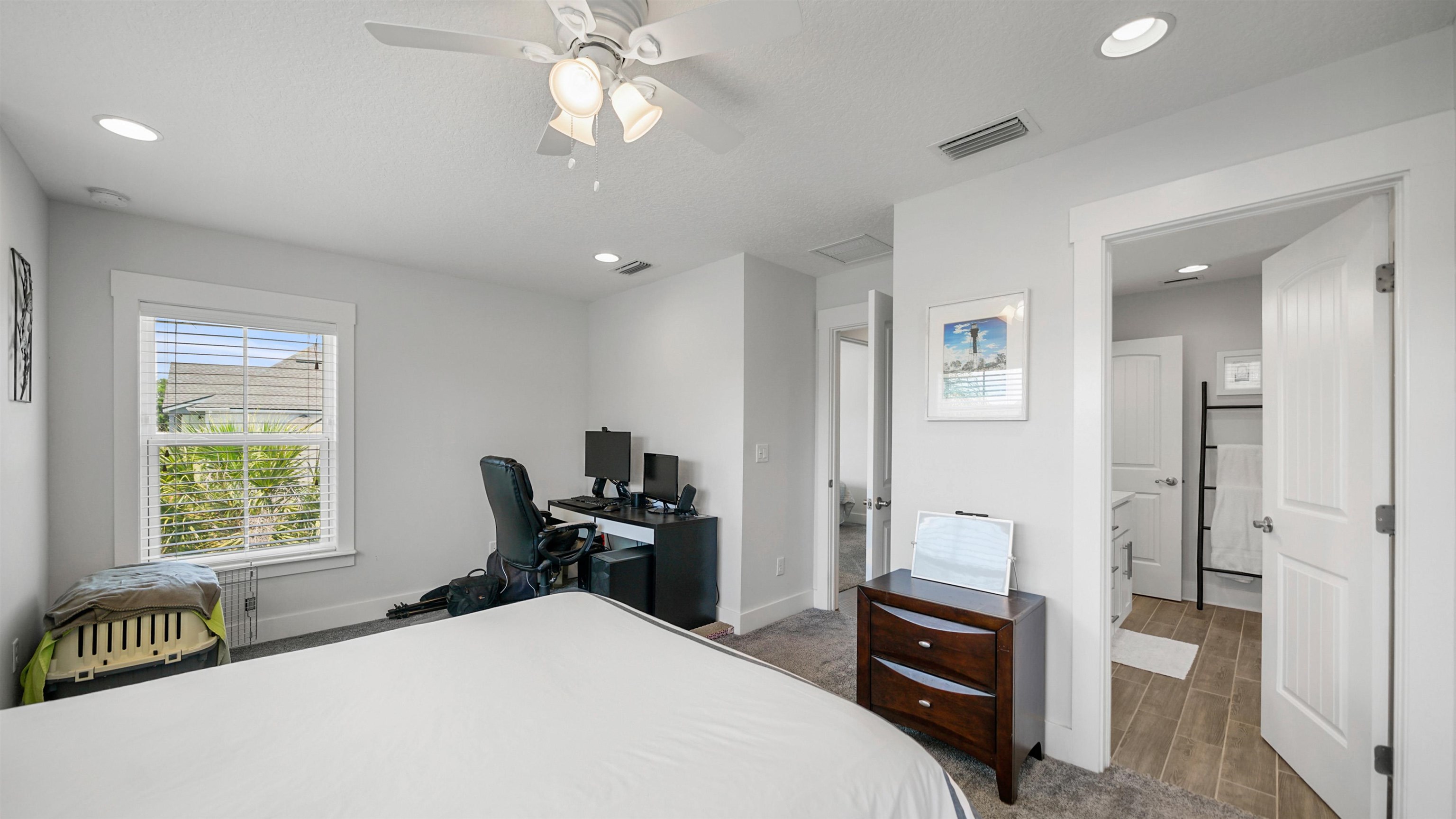 304 Ribault Street St. Augustine, FL 32080 - Photo 43 of 69 a bedroom with a bed and a chandelier