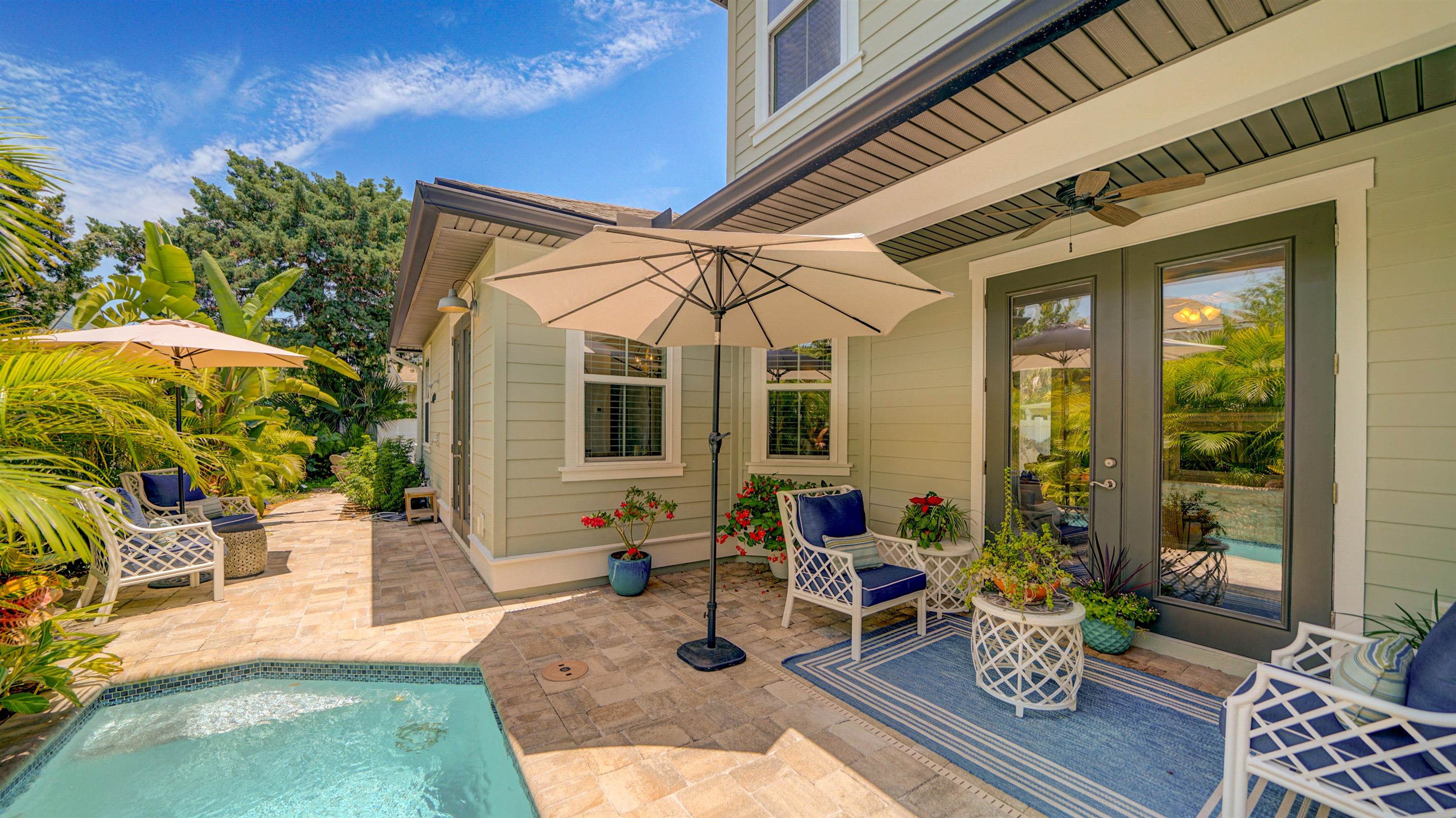304 Ribault Street St. Augustine, FL 32080 - Photo 46 of 69 a view of a patio with couches table and chairs and potted plants