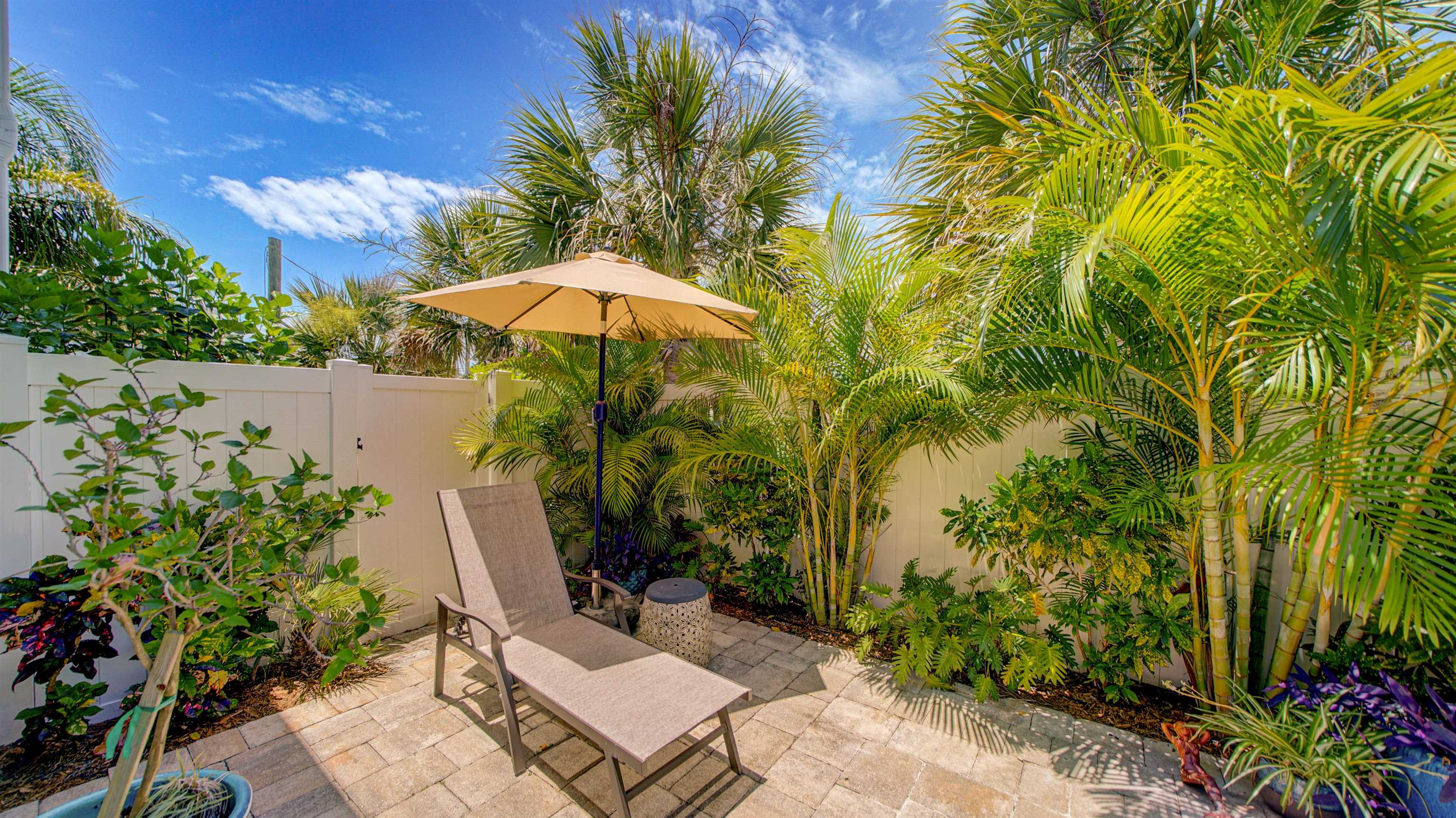 304 Ribault Street St. Augustine, FL 32080 - Photo 47 of 69 a view of a backyard with plants and a garden