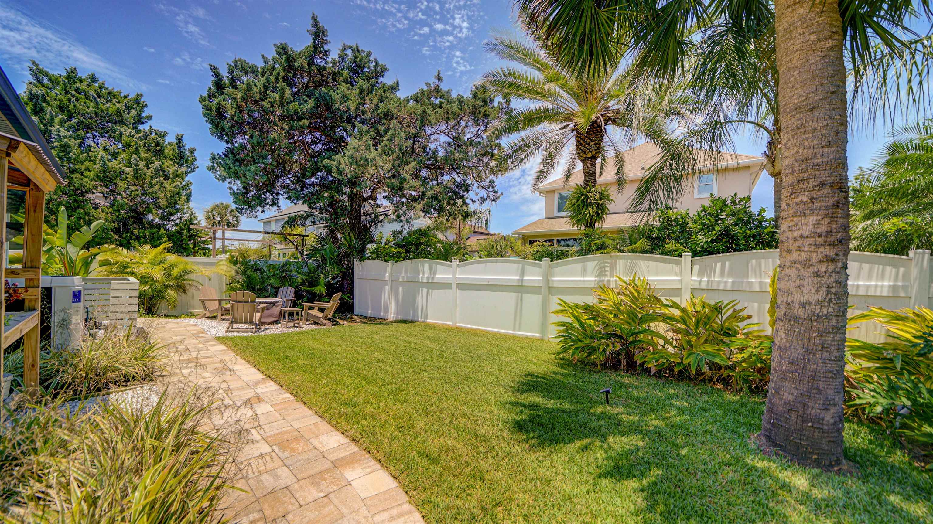 304 Ribault Street St. Augustine, FL 32080 - Photo 53 of 69 a view of a backyard with plants and swimming pool