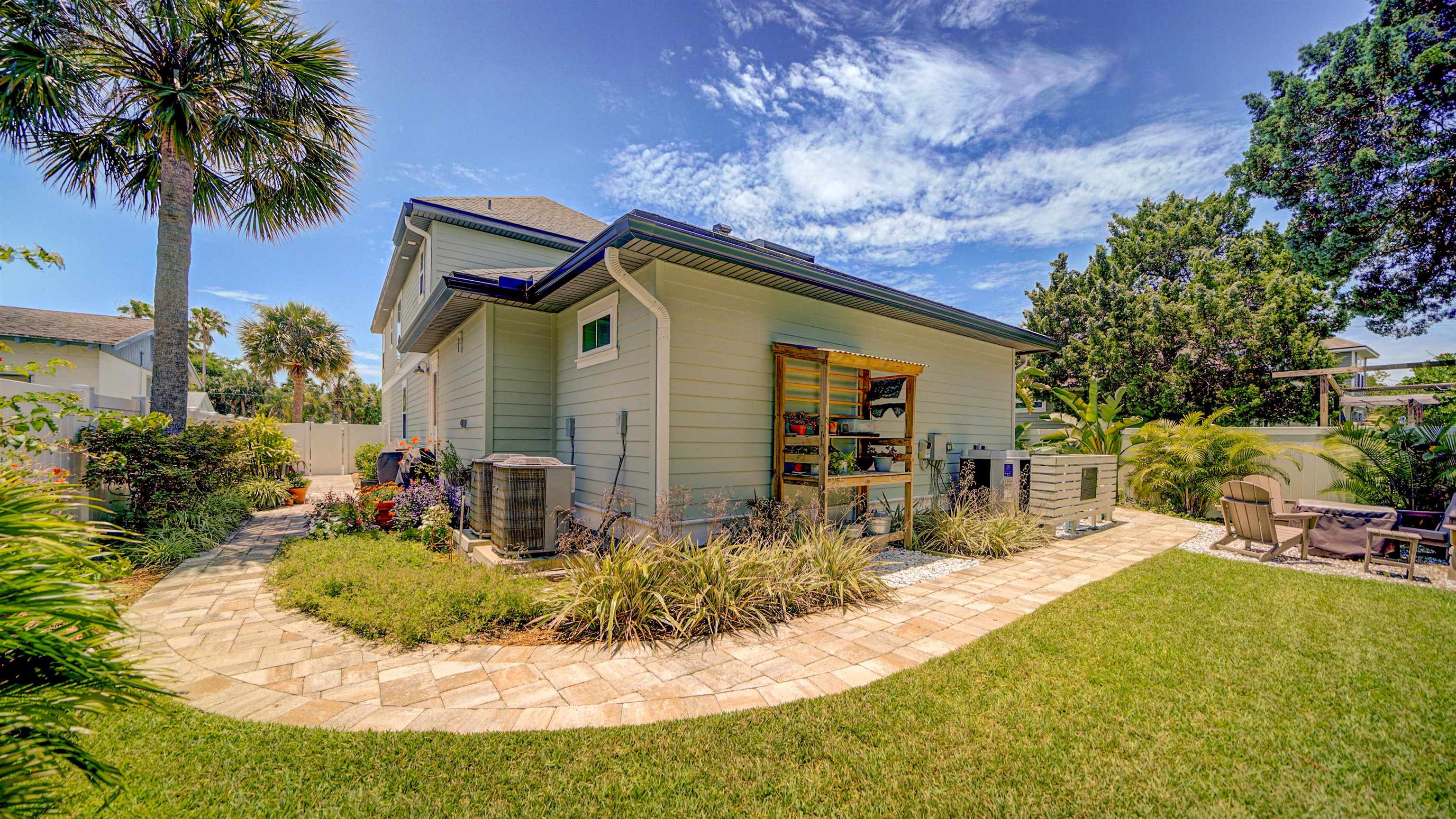 304 Ribault Street St. Augustine, FL 32080 - Photo 54 of 69 a front view of a house with yard and sitting area