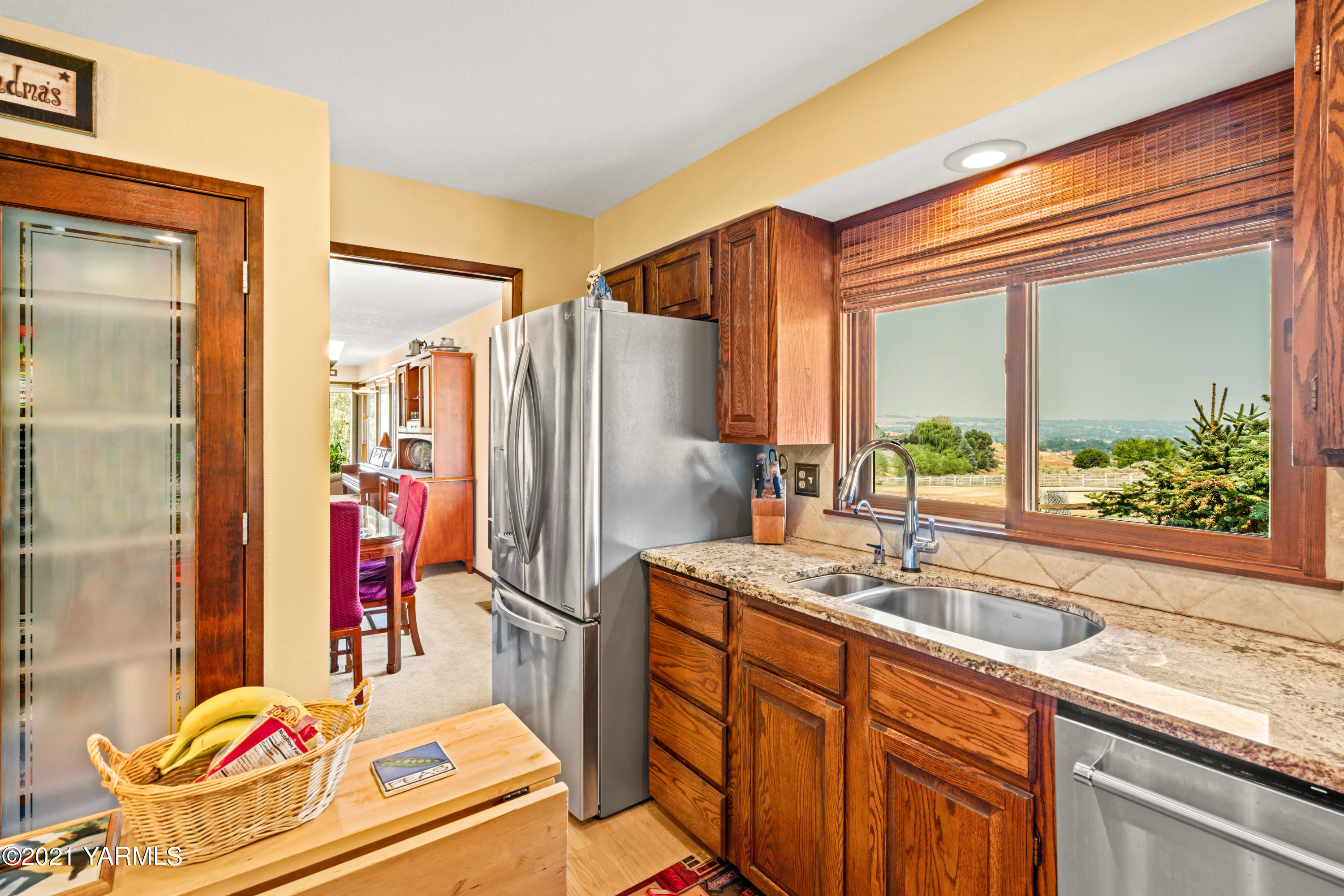 10906 Zier Road Yakima, WA 98908 - Photo 13 of 43 a kitchen with sink refrigerator and window