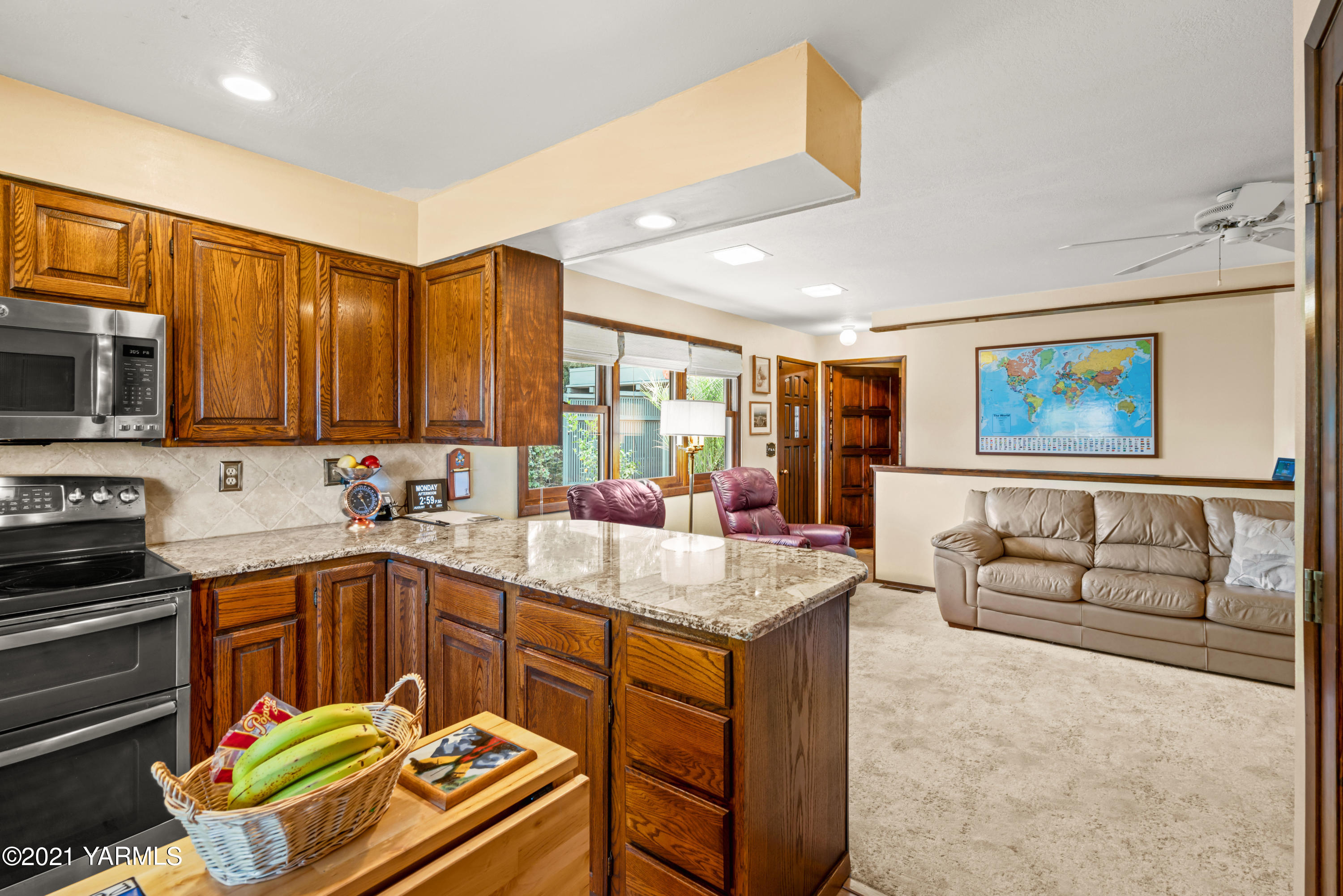 10906 Zier Road Yakima, WA 98908 - Photo 15 of 43 a kitchen with a sink stove and microwave