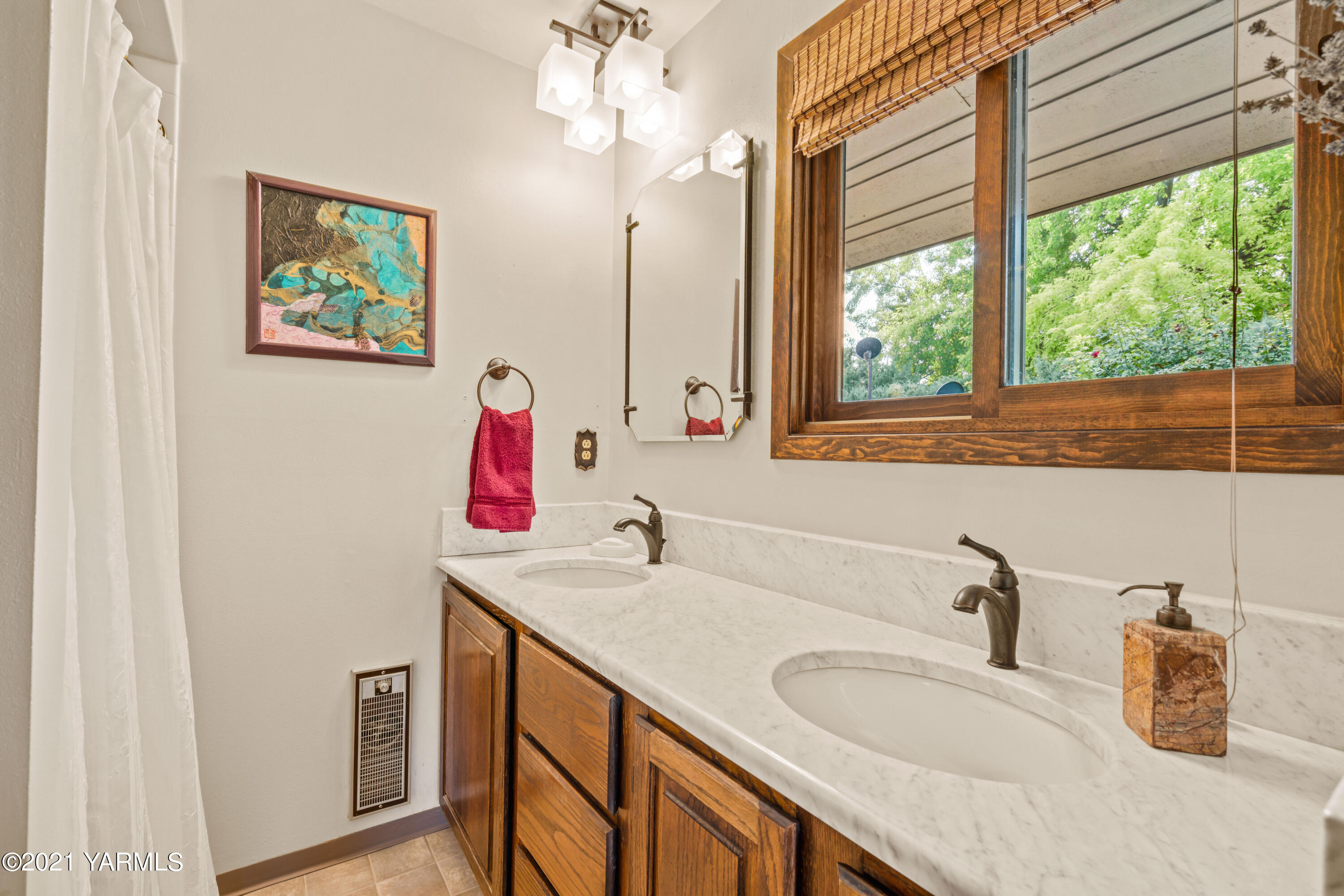 10906 Zier Road Yakima, WA 98908 - Photo 19 of 43 a bathroom with a sink and a mirror