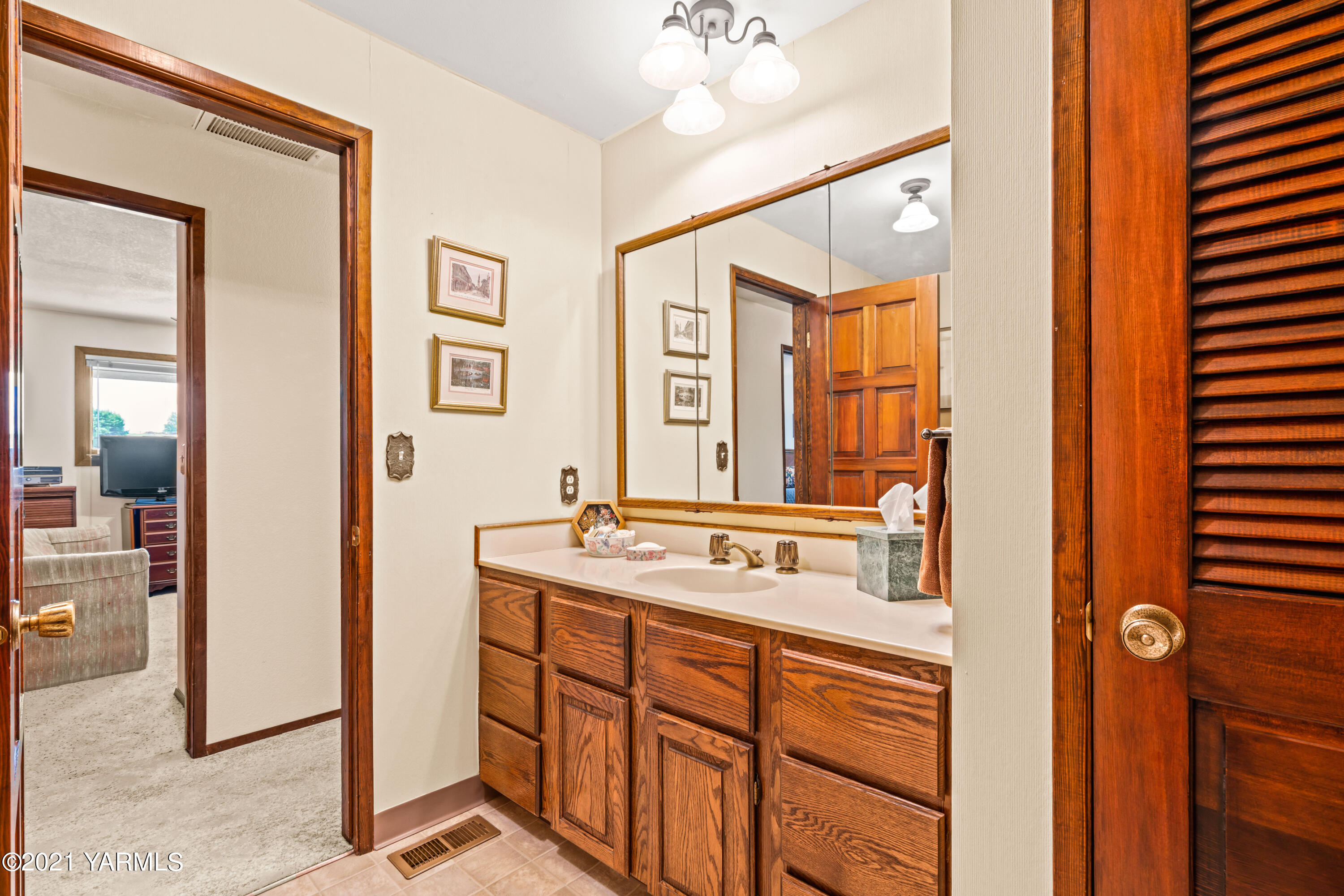 10906 Zier Road Yakima, WA 98908 - Photo 24 of 43 a bathroom with a sink and a mirror