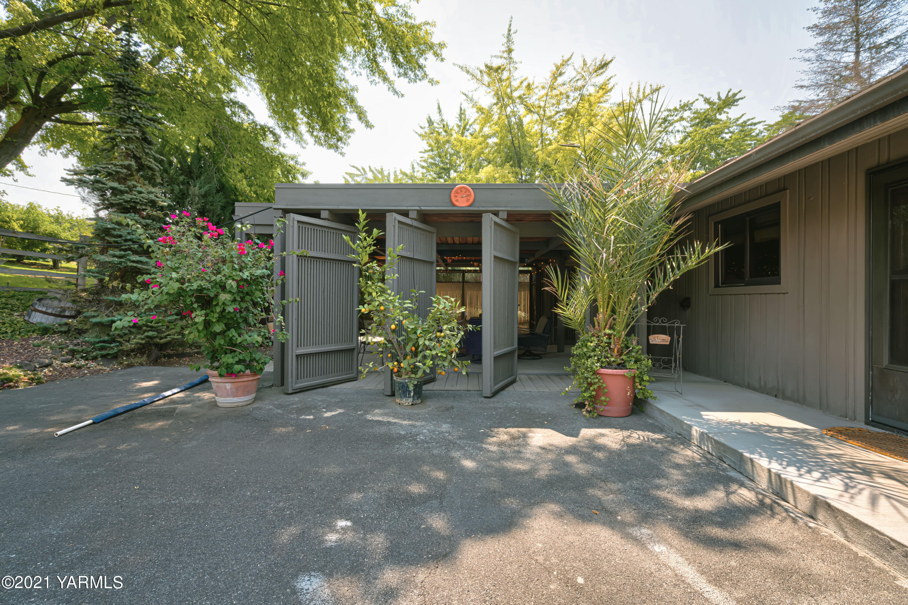 10906 Zier Road Yakima, WA 98908 - Photo 5 of 43 a view of a house with a sitting area and garden