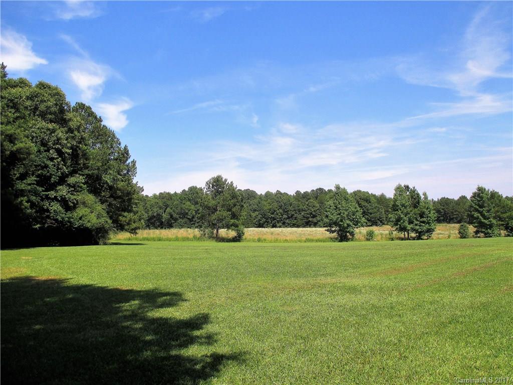 1640 Logan Terry Road, Unit 1 Lancaster, SC 29720 - Photo 1 of 24 a view of a big yard with a large trees