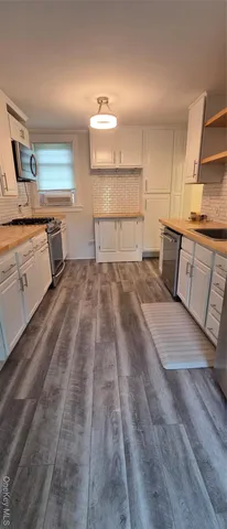 a spacious bedroom with a bed and window