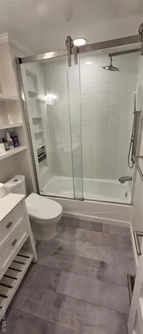 a bathroom with a shower and a toilet