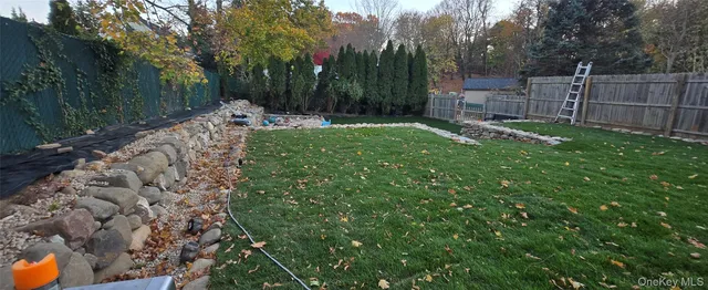 a backyard of a house with lots of green space