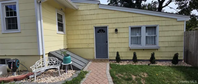 a front view of a house with patio