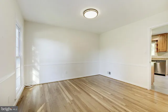 a kitchen with stainless steel appliances granite countertop a refrigerator stove and sink