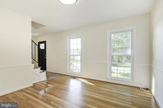 a kitchen with stainless steel appliances granite countertop a refrigerator stove and sink