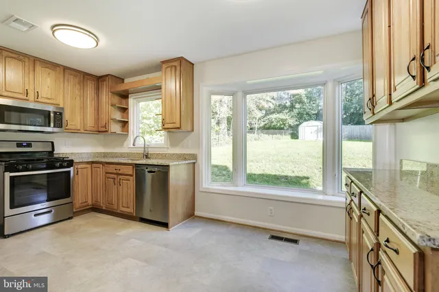 a living room with a fireplace and a rug