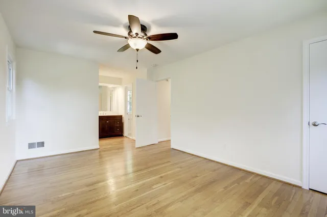 a bathroom with a granite countertop toilet a sink and a bathtub