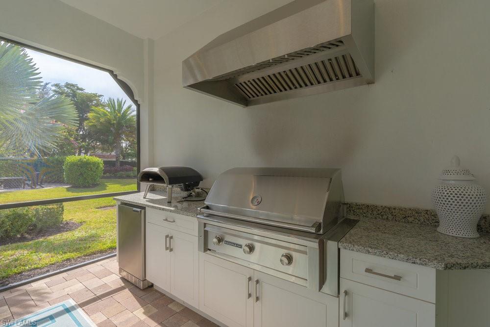 16366 Corsica Way, Unit 102 Naples, FL 34110 - Photo 15 of 28 Summer Kitchen with gas grill, no pizza oven