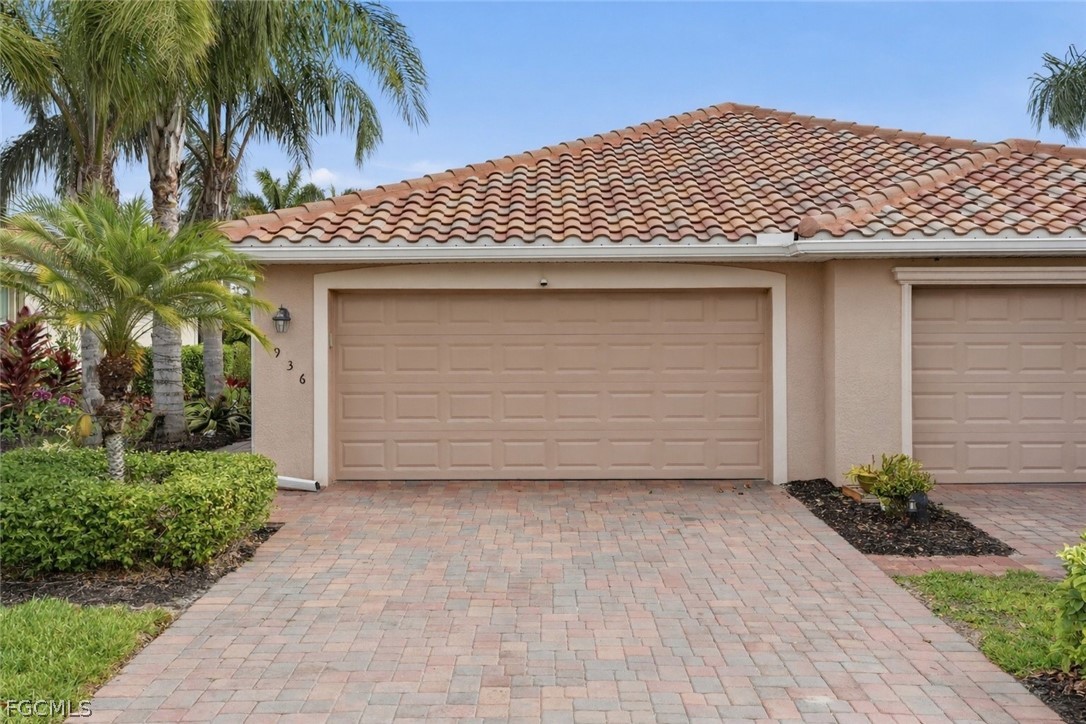 a front view of a house with garage