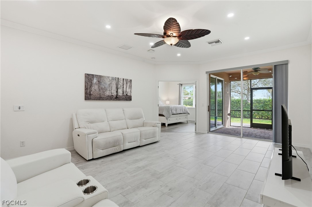 1936 Wellington Street Naples, FL 34120 - Photo 13 of 27 a living room with furniture and a large window